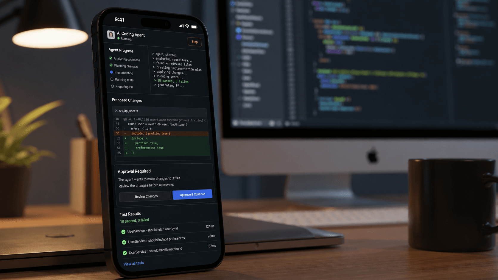Smartphone showing a Codex coding-agent dashboard beside a development workstation